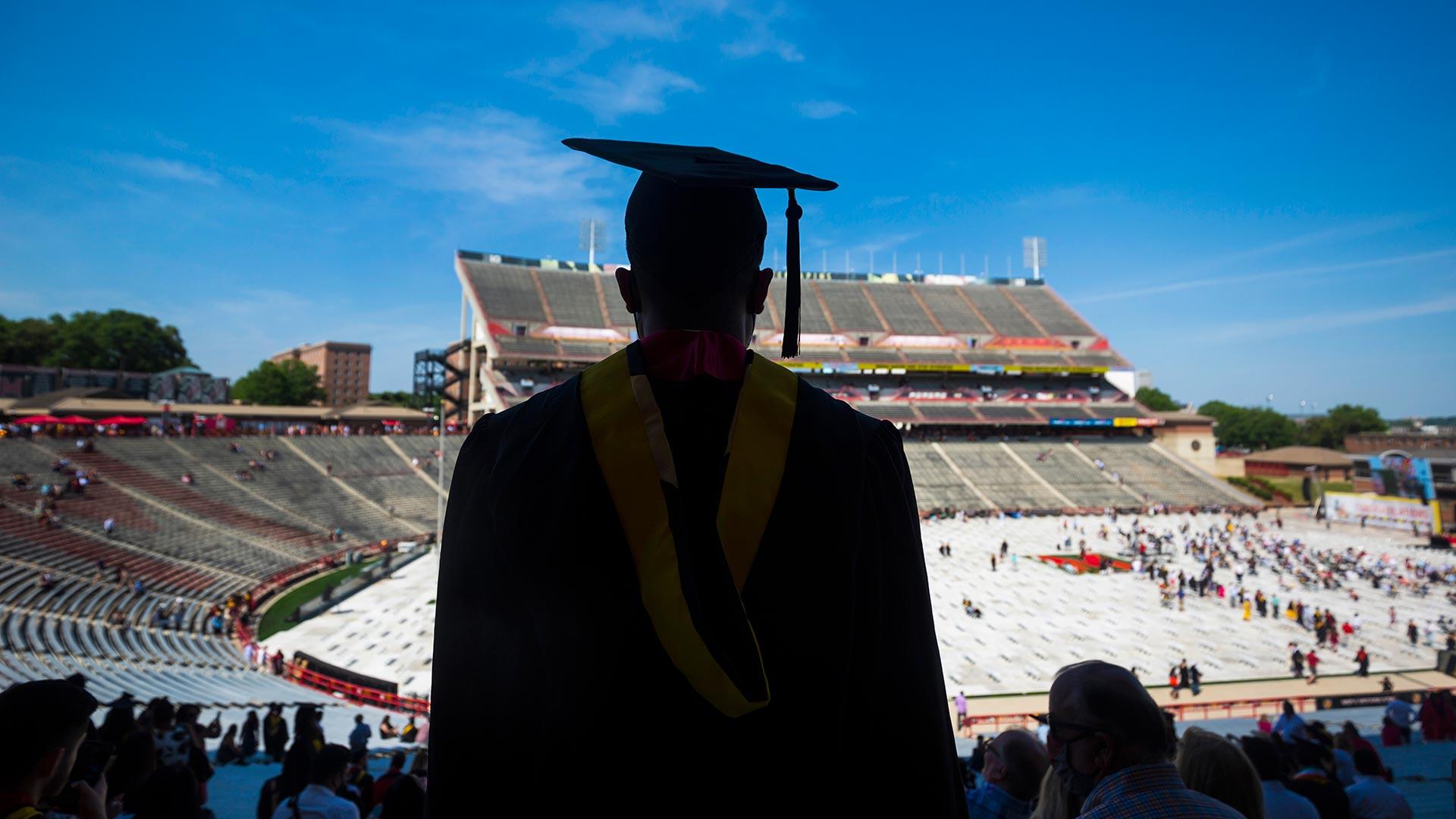 A UMD undergrad prepares to participate in commencement. The university ranked among the leading institutions nationwide for graduating Black or African American bachelor's degree students who later earned doctoral degrees. Photo by Stephanie S. Cordle.