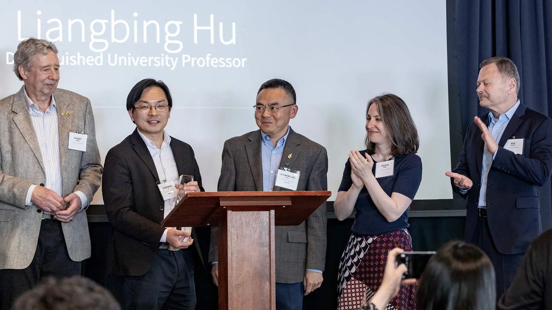 Distinguished University Professor Liangbing Hu (second from left) is honored at the Innovate Maryland Invention of the Year award event. Also pictured (from left), Professor Robert Briber, Department of Materials Science and Engineering Chair Ji-Cheng (JC) Zhao, UM Ventures Associate Director Felicia Metz, UM Ventures Executive Director Ken Porter.