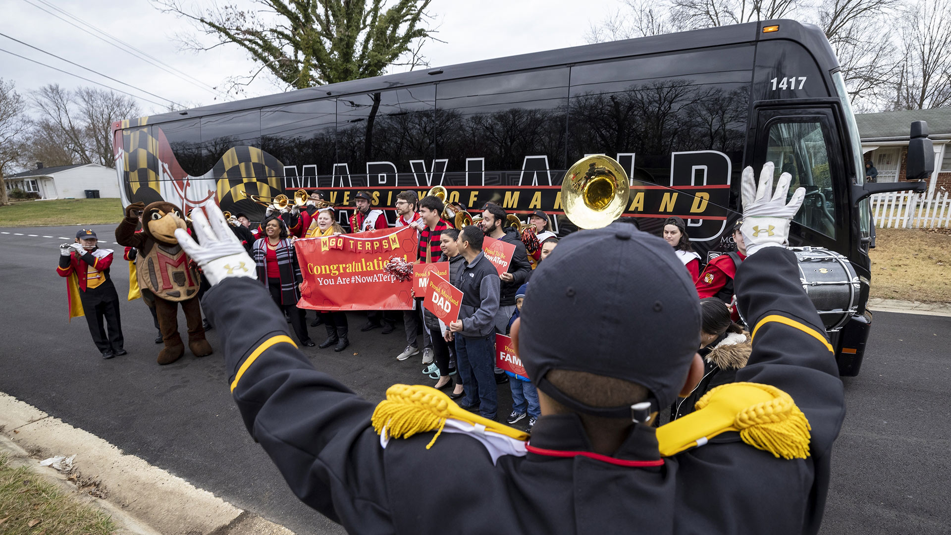Pompom-wielding undergraduate admissions staff, a contingent from the Mighty Sound of Maryland marching band and Testudo boarded a black and red UMD bus Sunday morning and trekked across the state to surprise three students with the news that they’d been accepted as freshmen for the Fall 2023 semester.
